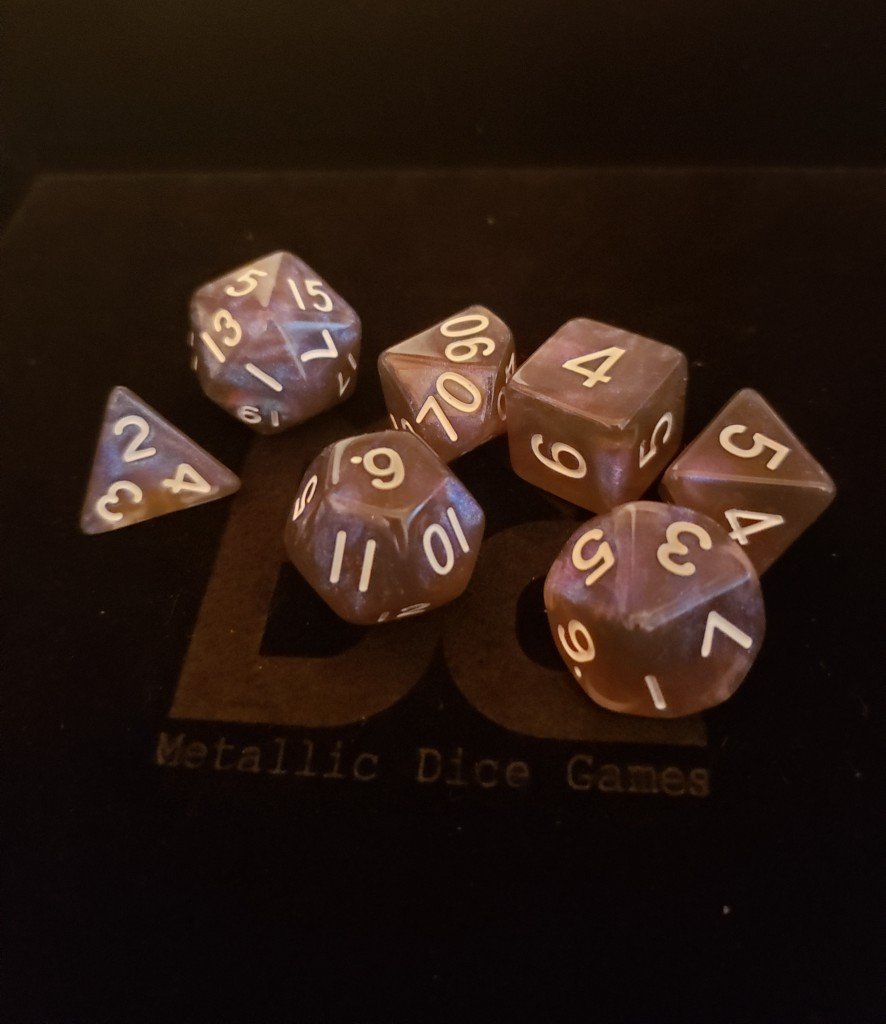 Stardust Galaxy. Black and blue dice with glitter
